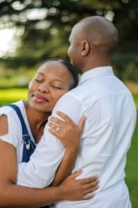 Couple hugging in park