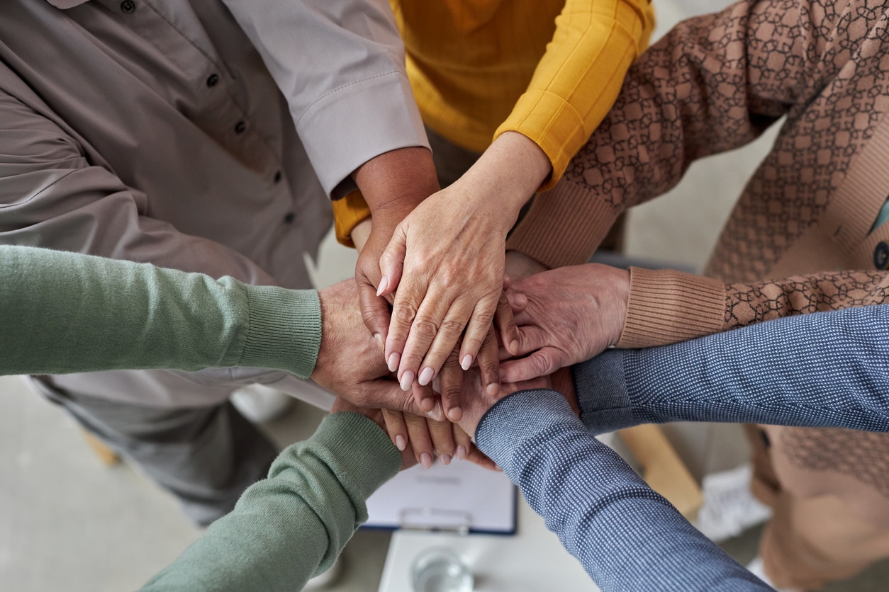 Participants in a supportive group therapy session, sharing experiences and fostering a sense of community in Denver, CO.