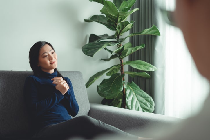 Patient engaging in Somatic Experiencing Therapy in Denver, CO, guided by a therapist to promote healing and stress reduction.